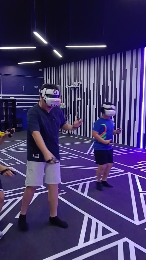 Crew mid-game in one world — guest photo, Cyberjaya arena