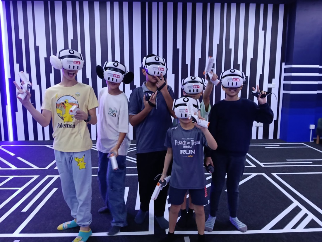 Birthday group cheering in VR headsets at the Cyberjaya arena — guest photo