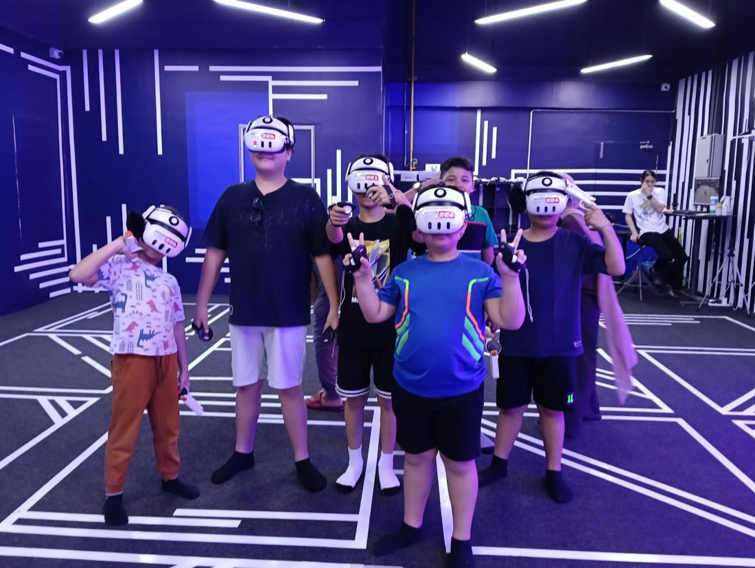 The whole party lined up in headsets — guest photo, Cyberjaya arena